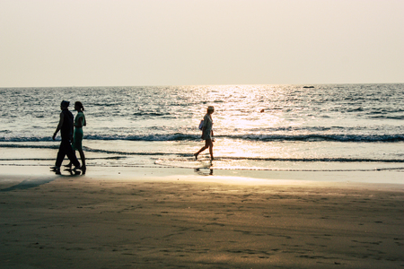 Arambol Goa India November 24, 2018 View of unknowns tourists visiting Goa and walking on the beach of Arambol in the afternoonのeditorial素材