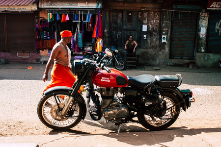 Gokarna Karnataka India December 07, 2018 Closeup of a classic Royal Enfield motorcycle parked in the main street of Gokarna in the morningのeditorial素材