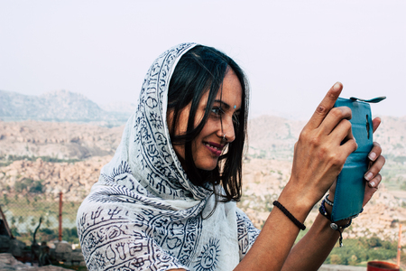 Hampi Karnataka India December 18, 2018 Portrait of Reachel Singh, Dutch professional singer taking inspiration at Hanuman temple in southern Indiaのeditorial素材