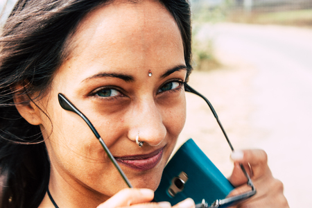 Hampi Karnataka India December 16, 2018 Portrait of Reachel Singh, Dutch professional singer taking inspiration and working on her latest album in Hampi countryside afternoonのeditorial素材