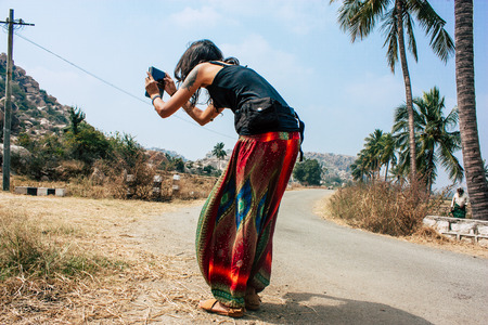 Hampi Karnataka India December 16, 2018 Portrait of Reachel Singh, Dutch professional singer taking inspiration and working on her latest album in Hampi countryside afternoonのeditorial素材