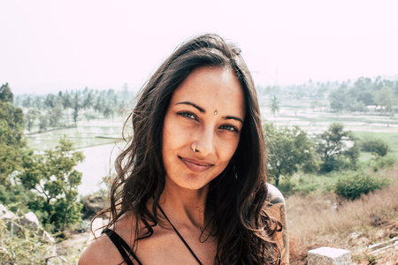 Hampi Karnataka India December 16, 2018 Portrait of Reachel Singh, Dutch professional singer taking inspiration and working on her latest album in Hampi countryside afternoonのeditorial素材