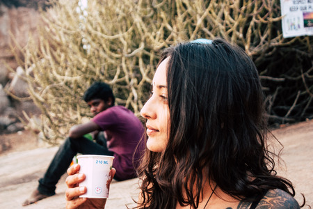 Hampi Karnataka India December 16, 2018 Portrait of Reachel Singh, Dutch professional singer taking inspiration and working on her latest album in Hampi countryside afternoonのeditorial素材