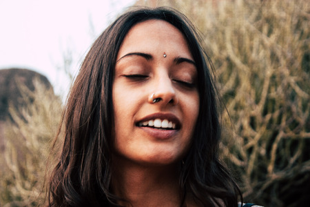 Hampi Karnataka India December 16, 2018 Portrait of Reachel Singh, Dutch professional singer taking inspiration and working on her latest album in Hampi countryside afternoonのeditorial素材