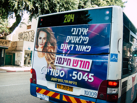 Tel Aviv Israel January 17, 2019 View of a classic Israeli city bus in the traffic circulation in the streets of Tel Aviv in the afternoonのeditorial素材