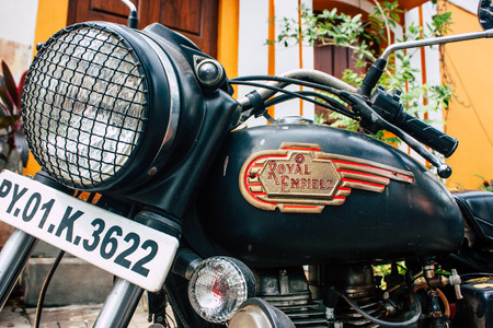 Pondicherry Tamil Nadu India January 21, 2019 View of a Royal Enfield motorcycle parked in the streets of White Town district in the french colonial city of Pondicherry in the morningのeditorial素材
