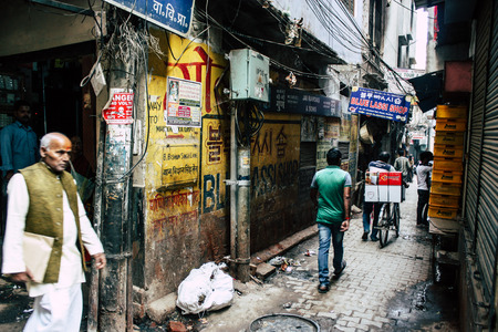 Varanasi India November 19, 2018 View of unknown Indian people walking in the narrow street in the old district of Varanasi in the afternoonのeditorial素材