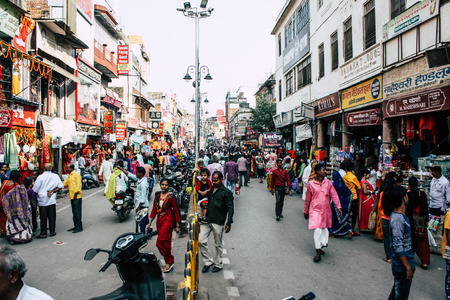 Varanasi India November 7, 2018 View of unknowns Indian people walking in the street to the ghat in...