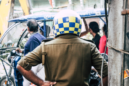 Varanasi India November 7, 2018 View of unknowns Indian people walking in the street to the ghat in Varanasi in the afternoonのeditorial素材
