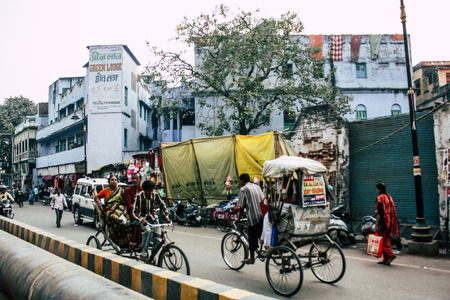 Varanasi India November 7, 2018 View of unknowns Indian people walking in the street to the ghat in Varanasi in the afternoonのeditorial素材