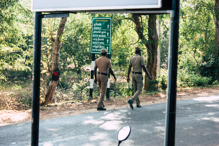 Auroville Tamil Nadu January 24, 2019 View of Indian police officers controling cars at the road to Auroville in southern India in the afternoonのeditorial素材