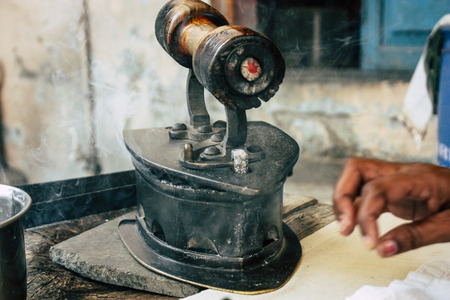 Varanasi India November 7, 2018 Closeup of a traditional iron with charcoal used in the streets of Varanasi in the morningのeditorial素材