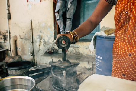 Varanasi India November 7, 2018 Closeup of a traditional iron with charcoal used in the streets of Varanasi in the morningのeditorial素材
