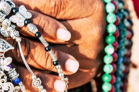 Om beach Gokarna Karnataka India February 1, 2019 Closeup of colorful jewelry sold on the beach in southern India in the afternoonの写真素材