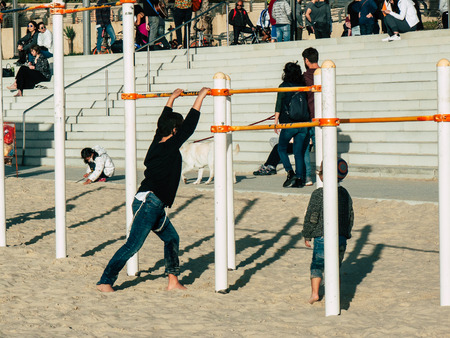Tel Aviv Israel February 9, 2019 View of unknowns Israeli kids playing on the beach of Tel Aviv in...
