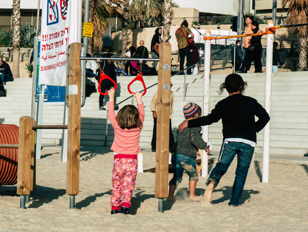 Tel Aviv Israel February 9, 2019 View of unknowns Israeli kids playing on the beach of Tel Aviv in...