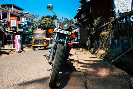 Gokarna Karnataka India February 13, 2019 Closeup of a Royal Enfield motorcycle parked in main road of Gokarna town in the morningのeditorial素材