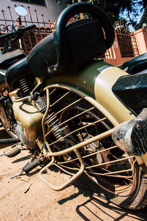 Gokarna Karnataka India February 13, 2019 Closeup of a Royal Enfield motorcycle parked in main road of Gokarna town in the morningのeditorial素材