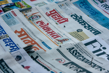 Mumbai India March 2, 2019 Closeup of traditional newspapers sold in the streets of Mumbai in the morningのeditorial素材