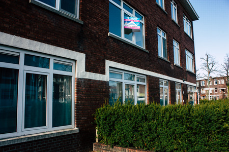 Voorburg Netherlands March 9, 2019 View of the traditional lower brick building located in the street of Voorburg in the afternoonのeditorial素材