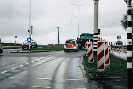 Papendrecht Netherlands March 12, 2019 View of a Duch police car rolling in the streets of Papendrecht in the afternoonのeditorial素材