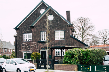 Papendrecht Netherlands March 12, 2019 View of the traditional Dutch lower brick building located in the streets of Papendrecht in the afternoonのeditorial素材