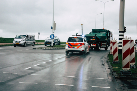Papendrecht Netherlands March 12, 2019 View of a Duch police car rolling in the streets of Papendrecht in the afternoonのeditorial素材