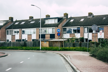 Papendrecht Netherlands March 12, 2019 View of the traditional Dutch lower brick building located in the streets of Papendrecht in the afternoonのeditorial素材