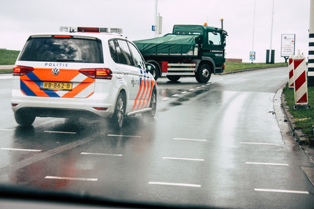 Papendrecht Netherlands March 12, 2019 View of a Duch police car rolling in the streets of Papendrecht in the afternoonのeditorial素材