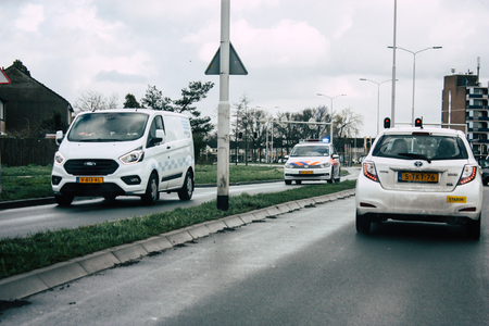 Papendrecht Netherlands March 12, 2019 View of a Duch police car rolling in the streets of Papendrecht in the afternoonのeditorial素材