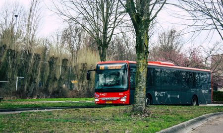 Papendrecht Netherlands March 12, 2019 View of a classic Duch city bus rolling in the streets of Papendrecht in the afternoonのeditorial素材