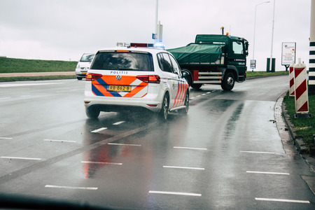 Papendrecht Netherlands March 12, 2019 View of a Duch police car rolling in the streets of Papendrecht in the afternoonのeditorial素材