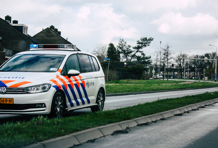 Papendrecht Netherlands March 12, 2019 View of a Duch police car rolling in the streets of Papendrecht in the afternoonのeditorial素材