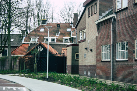 Papendrecht Netherlands March 12, 2019 View of the traditional Dutch lower brick building located in the streets of Papendrecht in the afternoonのeditorial素材