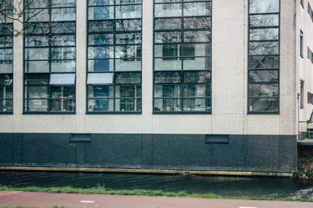 Papendrecht Netherlands March 12, 2019 View of the traditional Dutch lower brick building located in the streets of Papendrecht in the afternoonのeditorial素材