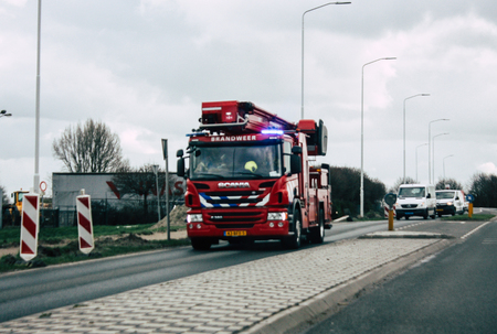 Papendrecht Netherlands March 12, 2019 View of a Duch fire engine rolling in the streets of Papendrecht in the afternoonのeditorial素材