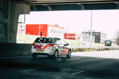 Rotterdam Netherlands March 18, 2019 View of a Dutch police car rolling in the highway in the...