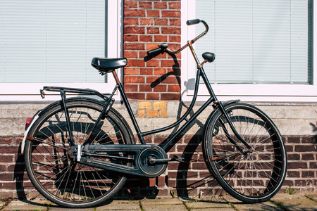 Voorburg Netherlands March 22, 2019 Closeup of traditional Dutch bicycle parked in the streets of Voorburg in the afternoonのeditorial素材