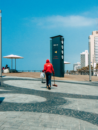 Tel Aviv Israel March 26, 2019 View of unknown Israeli people cleaning beach street in Tel Aviv in the afternoonのeditorial素材