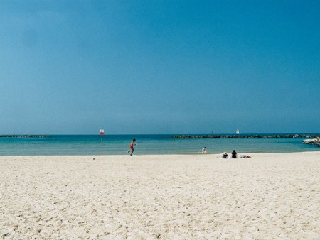 Tel Aviv Israel March 26, 2019 View of unknown Israeli people having fun on the beach of Tel Aviv in the afternoonのeditorial素材