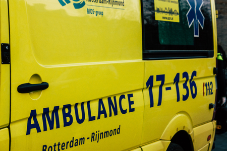 Rotterdam Netherlands April 1, 2019 View of a Dutch yellow ambulance parked in the streets of...