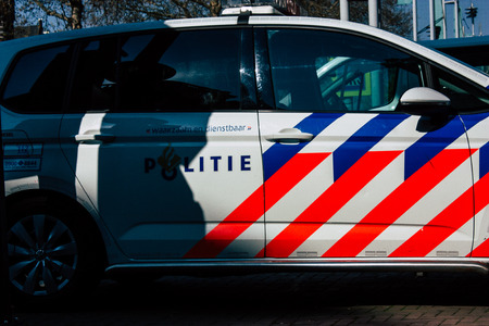 Amsterdam Netherlands April 8, 2019 View of a Dutch police car parked in the streets of Amsterdam in the afternoonのeditorial素材
