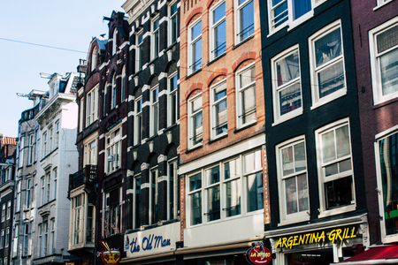 Amsterdam Netherlands April 8, 2019 View of the facade of a old Dutch building located in the Red Light quarter in Amsterdam in the eveningのeditorial素材