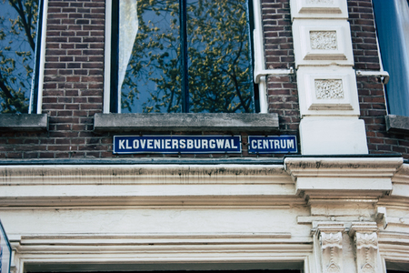 Amsterdam Netherlands April 8, 2019 View of the facade of a old Dutch building located in the Red Light quarter in Amsterdam in the eveningのeditorial素材