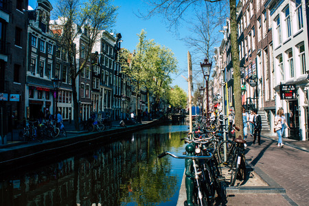 Amsterdam Netherlands April 8, 2019 View of the facade of a old Dutch building located in the Red Light quarter in Amsterdam in the eveningのeditorial素材