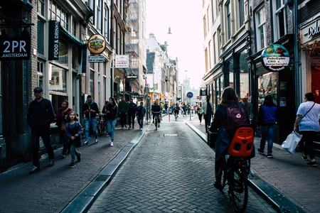 Amsterdam Netherlands April 8, 2019 View of unknowns people walking in the Red Light district in Amsterdam in the eveningのeditorial素材
