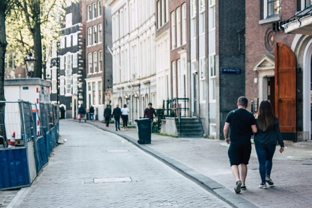Amsterdam Netherlands April 8, 2019 View of unknowns people walking in the Red Light district in Amsterdam in the eveningのeditorial素材