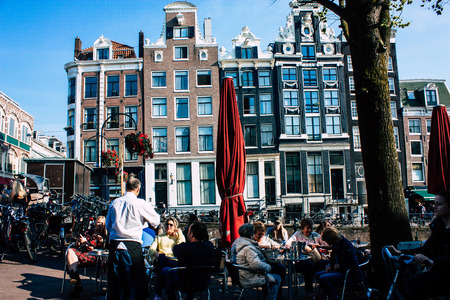 Amsterdam Netherlands April 8, 2019 View of unknowns people walking in the Red Light district in Amsterdam in the eveningのeditorial素材
