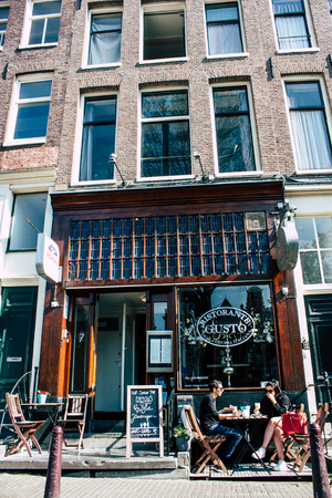Amsterdam Netherlands April 8, 2019 View of unknowns people walking in the Red Light district in Amsterdam in the eveningのeditorial素材
