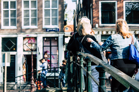 Amsterdam Netherlands April 8, 2019 View of unknowns people walking in the Red Light district in Amsterdam in the eveningのeditorial素材